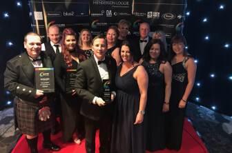 McLeod Glaziers pictured with the Courier Business award for family business of the year